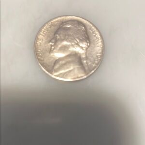 Vintage Silver Coin with Profile Design